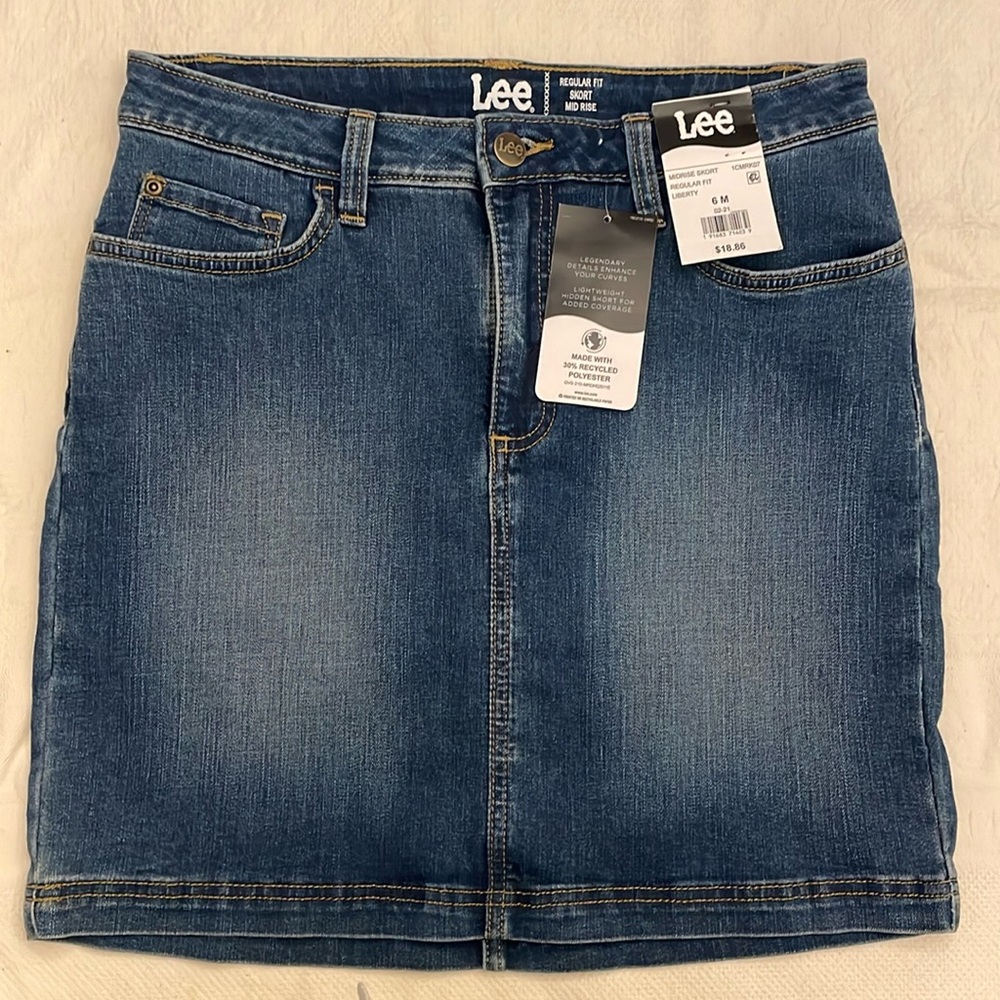 NWT. Lee Denim Midrise skort with hidden shorts. Size 6M.